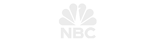 The NBC logo, featuring a stylized peacock with six feathers fanned out above the bold letters NBC, all in light gray on a white background, evokes the clarity and organization found in RadiantOne identity data and intelligence solutions.