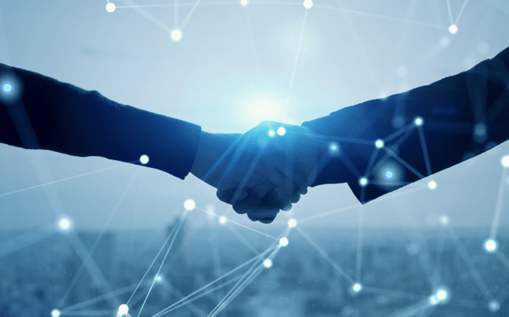 Two people shaking hands against a blue, abstract digital background with connecting lines and points, symbolizing networking, M&A identity integration, or business collaboration in a modern, technology-driven environment.
